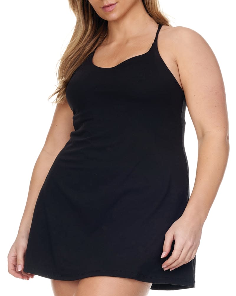 Front of a model wearing a size 1X Everyday 2-In-1 Tennis Dress in Black by Better Sports Performance. | dia_product_style_image_id:229540